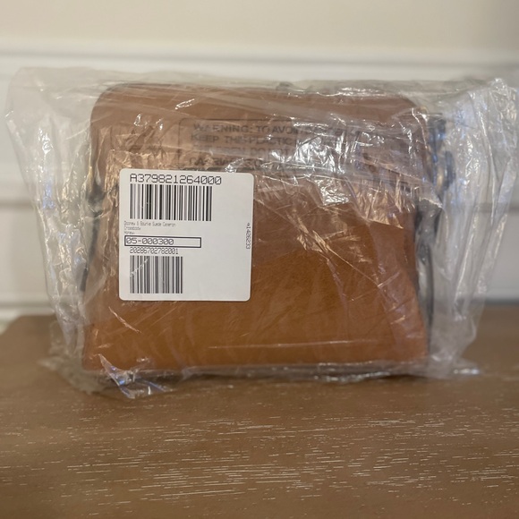 New Never used. Dooney and Bourke Suede Cameron Crossbod. Honey color - Picture 3 of 4